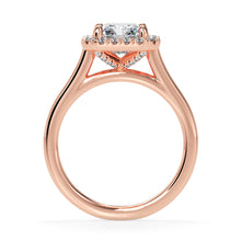 Rose gold radiant engagement ring with halo