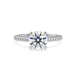 A dazzling round brilliant cut diamond set in a white gold engagement ring.